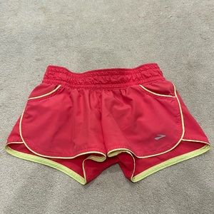 Pink and yellow Brooks shorts